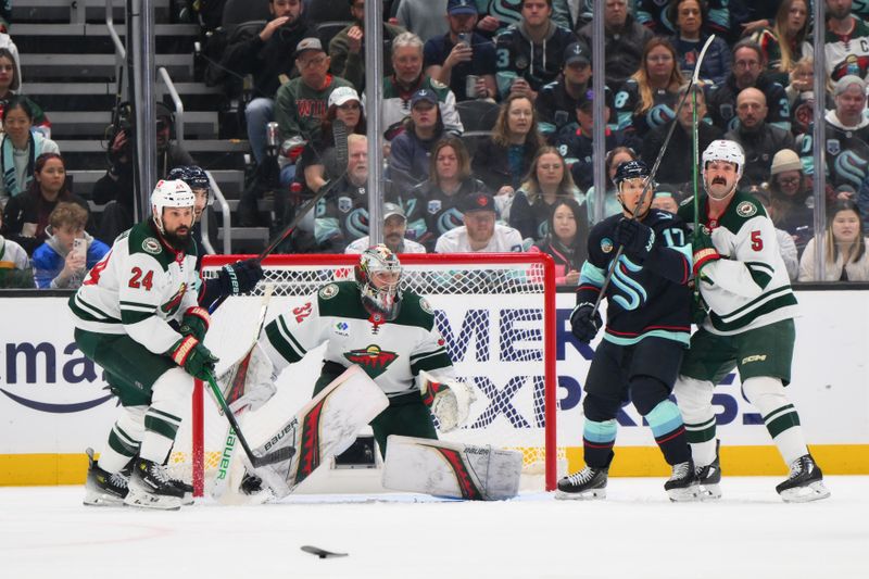 Mar 4, 2025; Seattle, Washington, USA; Minnesota Wild goaltender Filip Gustavsson (32) defends the goal against the Seattle Kraken during the second period at Climate Pledge Arena. Mandatory Credit: Steven Bisig-Imagn Images