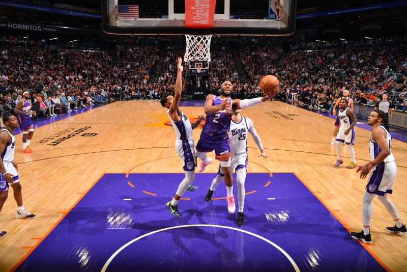 PHOENIX, AZ - FEBRUARY 13:  Josh Okogie #2 of the Phoenix Suns drives to the basket during the game against the Sacramento Kings on February 13, 2024 at Footprint Center in Phoenix, Arizona. NOTE TO USER: User expressly acknowledges and agrees that, by downloading and or using this photograph, user is consenting to the terms and conditions of the Getty Images License Agreement. Mandatory Copyright Notice: Copyright 2024 NBAE (Photo by Barry Gossage/NBAE via Getty Images)