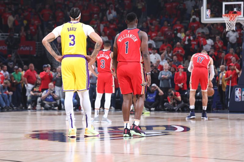 NEW ORLEANS, LA - APRIL 16: Anthony Davis #3 of the Los Angeles Lakers and Zion Williamson #1 of the New Orleans Pelicans look on before the game during the 2024 Play-In Tournament on April 16, 2024 at the Smoothie King Center in New Orleans, Louisiana. NOTE TO USER: User expressly acknowledges and agrees that, by downloading and or using this Photograph, user is consenting to the terms and conditions of the Getty Images License Agreement. Mandatory Copyright Notice: Copyright 2024 NBAE (Photo by Jeff Haynes/NBAE via Getty Images)