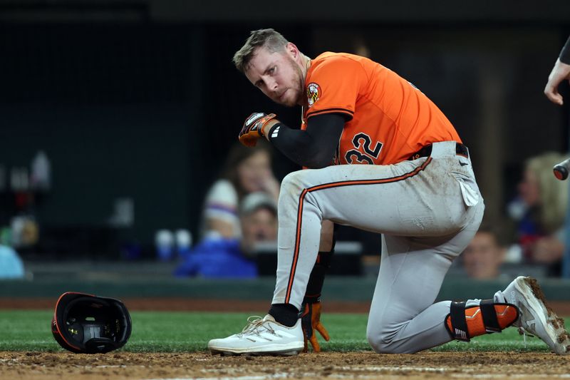 Jul 20, 2024; Arlington, Texas, USA; Baltimore Orioles first base Ryan O'Hearn (32) reacts after being hit by a pitch against the Texas Rangers in the seventh inning at Globe Life Field. Mandatory Credit: Tim Heitman-USA TODAY Sports