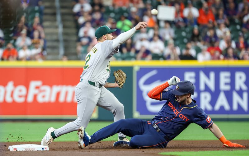 May 13, 2024; Houston, Texas, USA; Oakland Athletics shortstop Max Schuemann (12) forces Houston Astros right fielder Kyle Tucker (30) out at second base and throws out Houston Astros left fielder Yordan Alvarez (44) (not pictured) at second base  in the first inning  at Minute Maid Park. Mandatory Credit: Thomas Shea-USA TODAY Sports