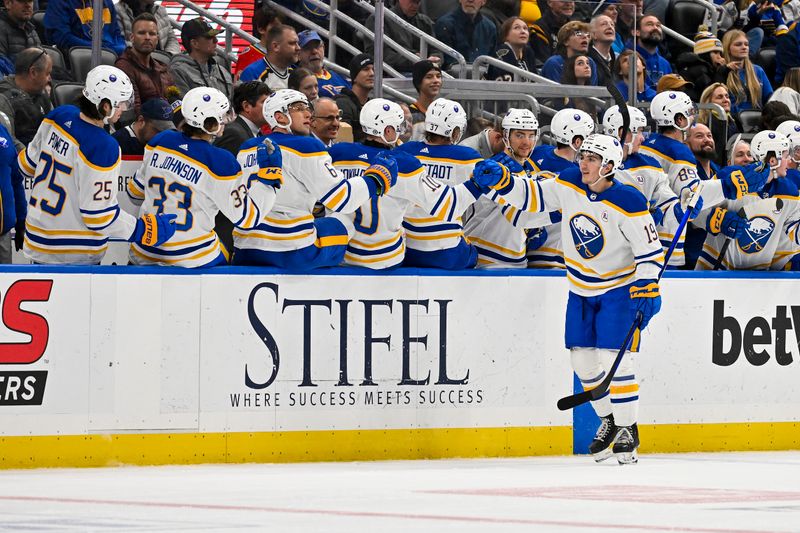 Nov 30, 2023; St. Louis, Missouri, USA;  Buffalo Sabres center Peyton Krebs (19) is congratulated by teammates after scoring against the St. Louis Blues during the second period at Enterprise Center. Mandatory Credit: Jeff Curry-USA TODAY Sports