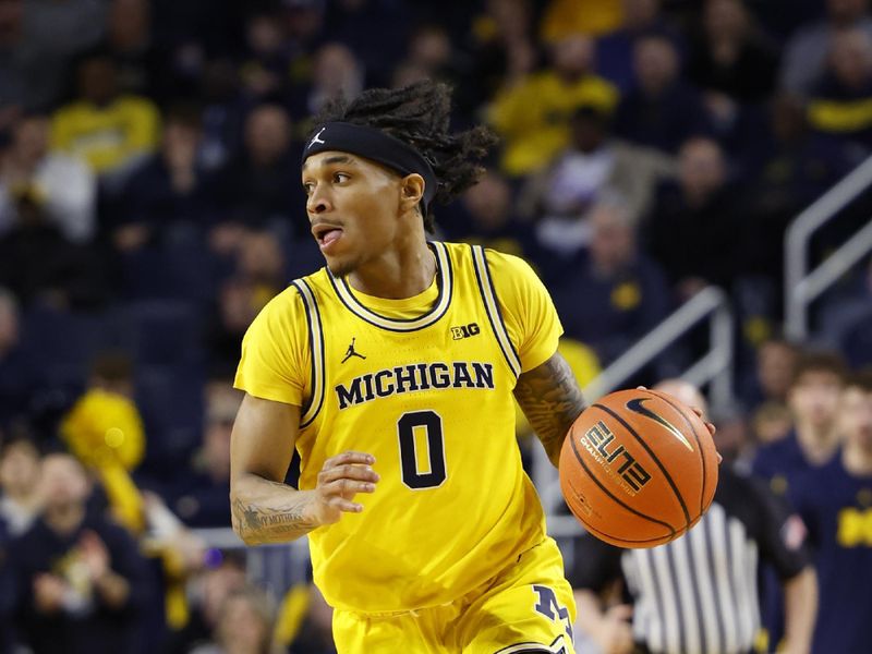 Feb 25, 2024; Ann Arbor, Michigan, USA;  Michigan Wolverines guard Dug McDaniel (0) dribbles in the first half against the Purdue Boilermakers at Crisler Center. Mandatory Credit: Rick Osentoski-USA TODAY Sports