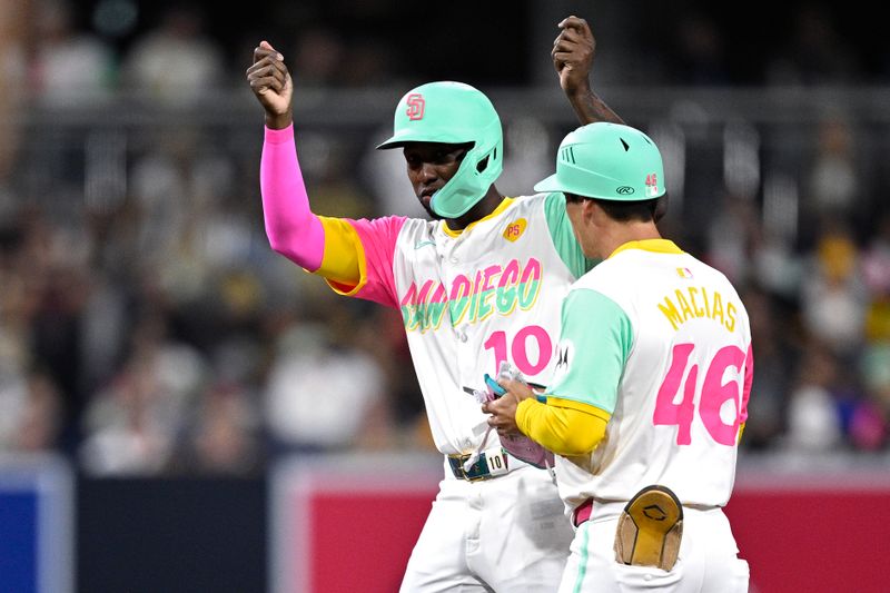 Jun 21, 2024; San Diego, California, USA; San Diego Padres left fielder Jurickson Profar (10) celebrates after hitting a double against the Milwaukee Brewers during the seventh inning at Petco Park. Mandatory Credit: Orlando Ramirez-USA TODAY Sports
