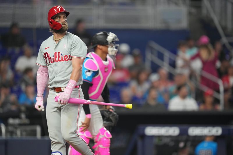 May 12, 2024; Miami, Florida, USA;  Philadelphia Phillies designated hitter Bryce Harper (3) strikes out in the eighth inning against the Miami Marlins at loanDepot Park. Mandatory Credit: Jim Rassol-USA TODAY Sports