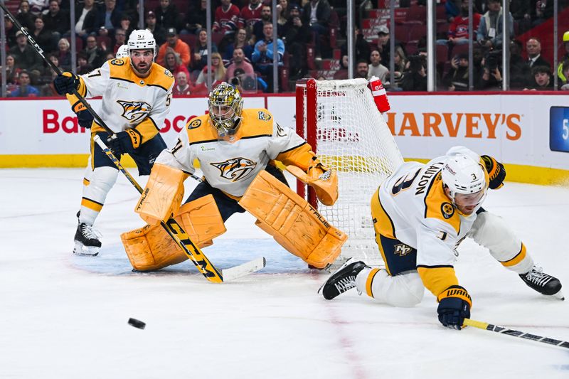 Dec 10, 2023; Montreal, Quebec, CAN; Nashville Predators goalie Juuse Saros (74) tracks the puck against the Montreal Canadiens during the first period at Bell Centre. Mandatory Credit: David Kirouac-USA TODAY Sports