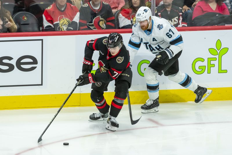 Jan 26, 2025; Ottawa, Ontario, CAN; Ottawa Senators center Ridly Greig (71) skates with the puck in front of Utah left wing Lawson Crouse (67) in the third period at the Canadian Tire Centre. Mandatory Credit: Marc DesRosiers-Imagn Images