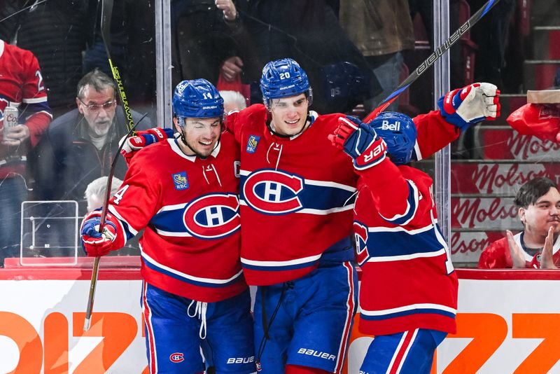 Mar 22, 2025; Montreal, Quebec, CAN; Montreal Canadiens left wing Juraj Slafkovsky (20) celebrates with center Nick Suzuki (14) and right wing Cole Caufield (13) his goal against the Colorado Avalanche in the third period at Bell Centre. Mandatory Credit: David Kirouac-Imagn Images