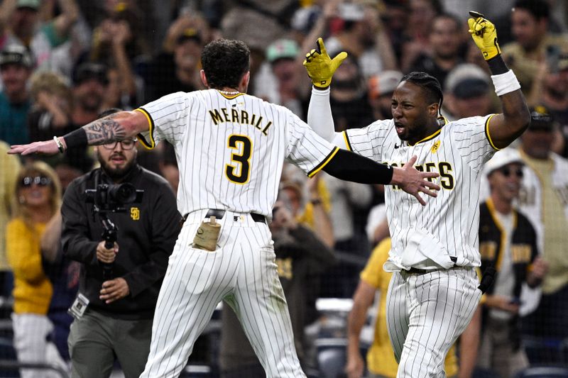 Jun 24, 2024; San Diego, California, USA; San Diego Padres left fielder Jurickson Profar (10) celebrates with center fielder Jackson Merrill (3) after hitting a walk-off single against the Washington Nationals at Petco Park. Mandatory Credit: Orlando Ramirez-USA TODAY Sports