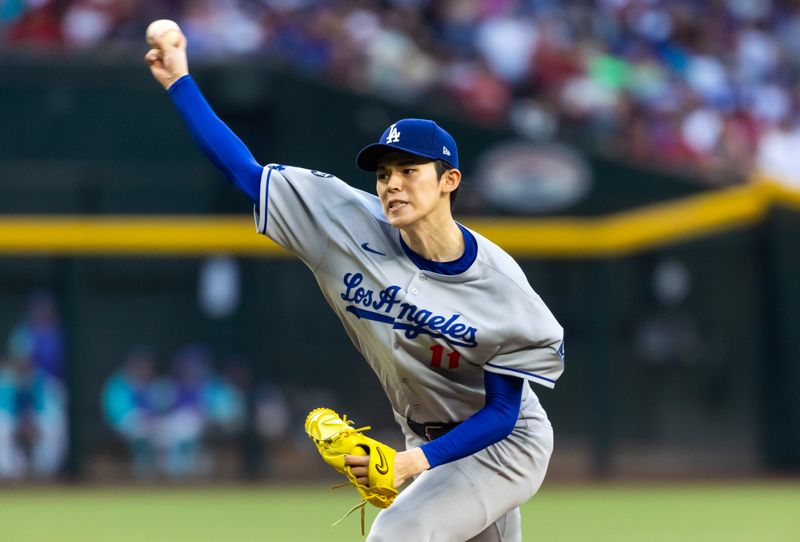 May 9, 2025; Phoenix, Arizona, USA; Los Angeles Dodgers pitcher Roki Sasaki against the Arizona Diamondbacks in the first inning at Chase Field. Mandatory Credit: Mark J. Rebilas-Imagn Images