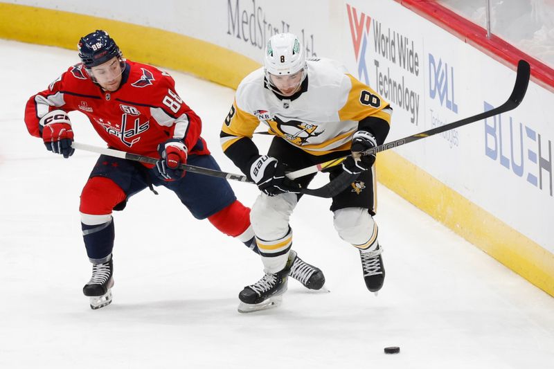 Nov 8, 2024; Washington, District of Columbia, USA; Pittsburgh Penguins left wing Michael Bunting (8) and Washington Capitals left wing Andrew Mangiapane (88) battle for the puck in the first period at Capital One Arena. Mandatory Credit: Geoff Burke-Imagn Images