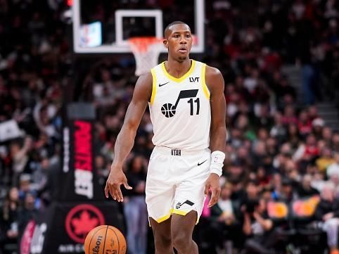 TORONTO, ON - DECEMBER 23: Kris Dunn #11 of the Utah Jazz dribbles against the Toronto Raptors during the second half of their basketball game at the Scotiabank Arena on December 23, 2023 in Toronto, Ontario, Canada. NOTE TO USER: User expressly acknowledges and agrees that, by downloading and/or using this Photograph, user is consenting to the terms and conditions of the Getty Images License Agreement. (Photo by Mark Blinch/Getty Images)