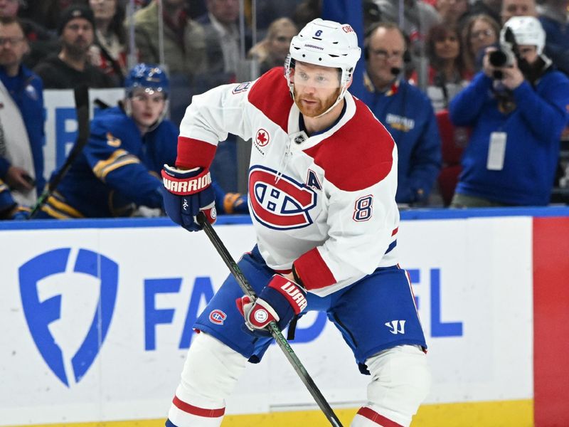 Nov 11, 2024; Buffalo, New York, USA; Montreal Canadiens defenseman Mike Matheson (8) handles the puck in the first period against the Buffalo Sabres at KeyBank Center. Mandatory Credit: Mark Konezny-Imagn Images