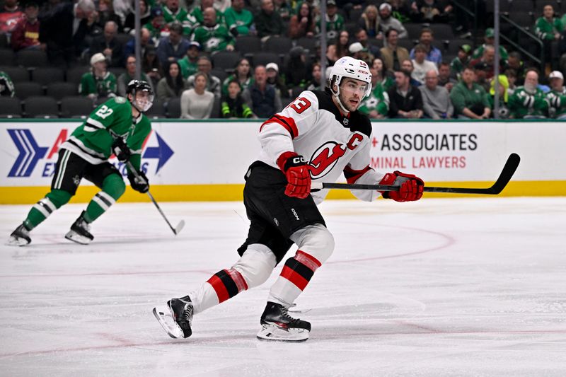 Mar 4, 2025; Dallas, Texas, USA; New Jersey Devils center Nico Hischier (13) skates against the Dallas Stars during the third period at the American Airlines Center. Mandatory Credit: Jerome Miron-Imagn Images