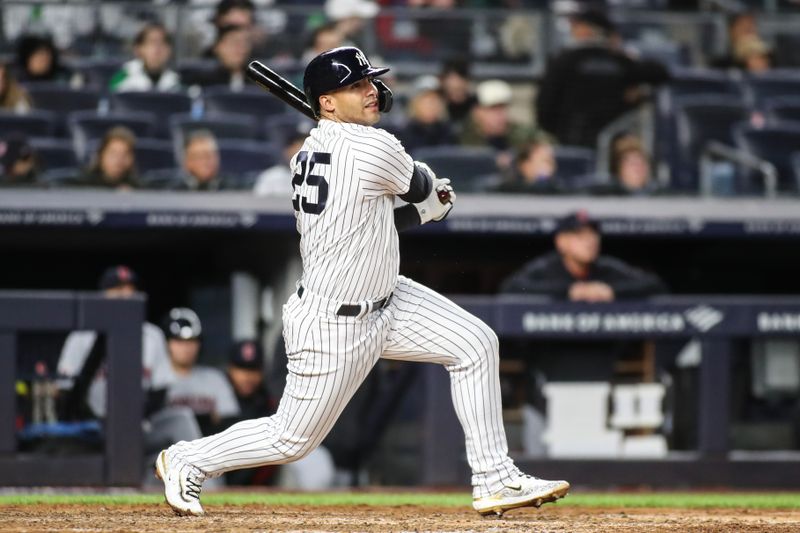 May 2, 2023; Bronx, New York, USA;  New York Yankees second baseman Gleyber Torres (25) hits a double in the sixth inning against the Cleveland Guardians at Yankee Stadium. Mandatory Credit: Wendell Cruz-USA TODAY Sports