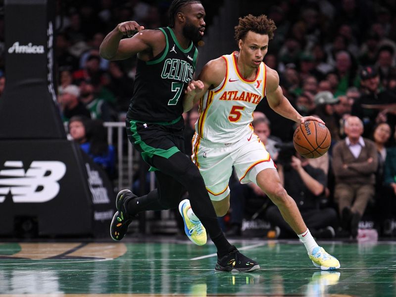 BOSTON, MASSACHUSETTS - NOVEMBER 12: Dyson Daniels #5 of the Atlanta Hawks brings the ball up court against Jaylen Brown #7 of the Boston Celtics during the first half of an Emirates NBA cup game  at TD Garden on November 12, 2024 in Boston, Massachusetts. NOTE TO USER: User expressly acknowledges and agrees that, by downloading and or using this photograph, User is consenting to the terms and conditions of the Getty Images License Agreement. (Photo by China Wong/Getty Images)