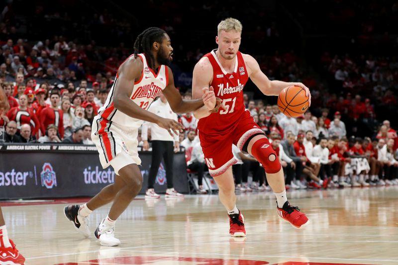 Feb 29, 2024; Columbus, Ohio, USA;  Nebraska Cornhuskers forward Rienk Mast (51) dribbles past Ohio State Buckeyes guard Evan Mahaffey (12) during the first half at Value City Arena. Mandatory Credit: Joseph Maiorana-USA TODAY Sports