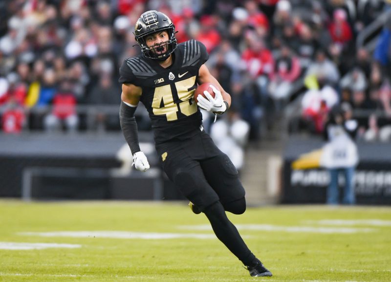 Oct 14, 2023; West Lafayette, Indiana, USA; Purdue Boilermakers running back Devin Mockobee (45) runs the ball during the first half at Ross-Ade Stadium. Mandatory Credit: Robert Goddin-USA TODAY Sports