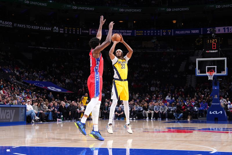 PHILADELPHIA, PA - DECEMBER 13: Myles Turner #33 of the Indiana Pacers shoots a three point basket during the game  against the Philadelphia 76ers on December 13, 2024 at the Wells Fargo Center in Philadelphia, Pennsylvania NOTE TO USER: User expressly acknowledges and agrees that, by downloading and/or using this Photograph, user is consenting to the terms and conditions of the Getty Images License Agreement. Mandatory Copyright Notice: Copyright 2024 NBAE (Photo by Jesse D. Garrabrant/NBAE via Getty Images)