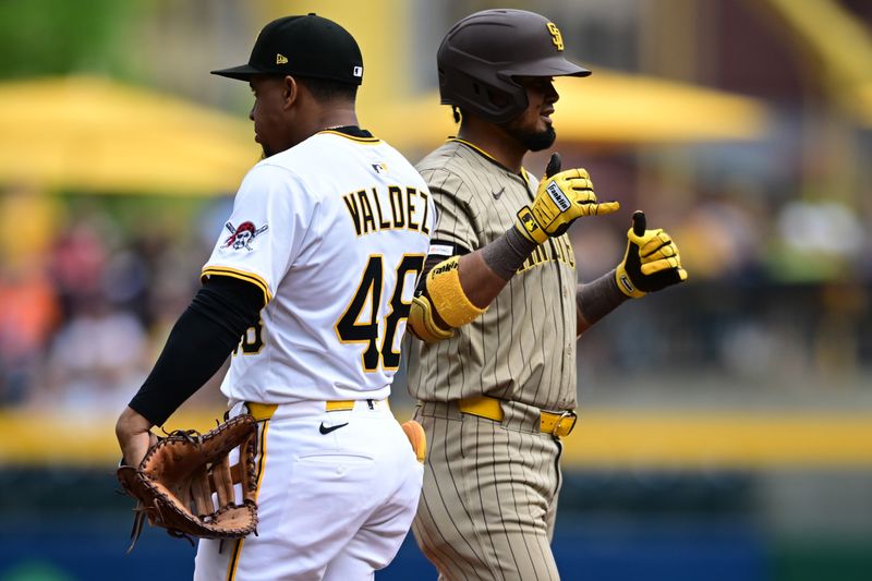 May 4, 2025; Pittsburgh, Pennsylvania, USA; San Diego Padres first baseman Luis Arraez (4) reacts after hitting a single during the sixth inning against the Pittsburgh Pirates at PNC Park. Mandatory Credit: David Dermer-Imagn Images