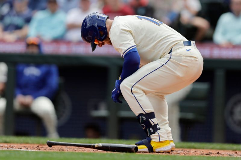 Jun 30, 2024; Seattle, Washington, USA; Seattle Mariners catcher Mitch Garver (18) reacts after he is hit by a pitch against the Minnesota Twins during the second inning at T-Mobile Park. Mandatory Credit: John Froschauer-USA TODAY Sports