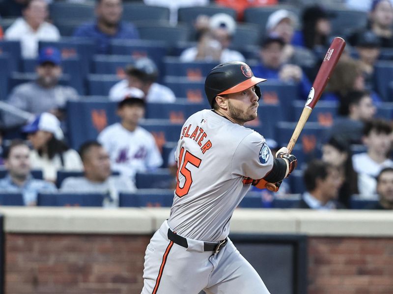 Aug 20, 2024; New York City, New York, USA;  Baltimore Orioles left fielder Austin Slater (15) hits a single in the first inning against the New York Mets at Citi Field. Mandatory Credit: Wendell Cruz-USA TODAY Sports