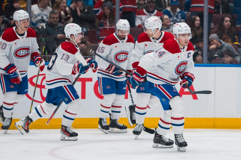 Mar 11, 2025; Vancouver, British Columbia, CAN; Montreal Canadiens forward Nick Suzuki (14) celebrates his goal against the Vancouver Canucks in the first period at Rogers Arena. Mandatory Credit: Bob Frid-Imagn Images
