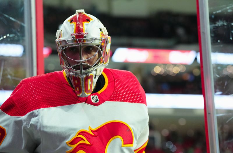 Mar 10, 2024; Raleigh, North Carolina, USA;  Calgary Flames goaltender Dan Vladar (80) comes off the ice after the warmups before the game against the Carolina Hurricanes at PNC Arena. Mandatory Credit: James Guillory-USA TODAY Sports