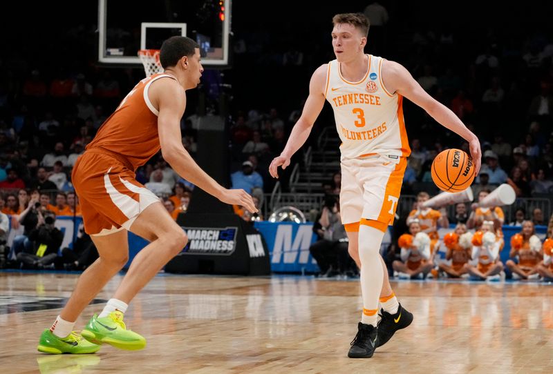 March 23, 2024, Charlotte, NC, USA;  Tennessee Volunteers guard Dalton Knecht (3) is defended by Texas Longhorns forward Kadin Shedrick (5) in the second round of the 2024 NCAA Tournament at the Spectrum Center. Mandatory Credit: Jim Dedmon-USA TODAY Sports