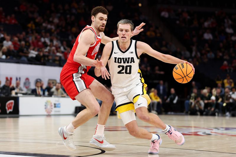 Mar 14, 2024; Minneapolis, MN, USA; Iowa Hawkeyes forward Payton Sandfort (20) dribbles around Ohio State Buckeyes forward Jamison Battle (10) during the first half at Target Center. Mandatory Credit: Matt Krohn-USA TODAY Sports