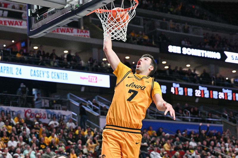 Dec 20, 2025; Iowa City, Iowa, USA; Iowa Hawkeyes forward Alvaro Folgueiras (7) goes to the basket for a slam dunk against the Bucknell Bison during the first half at Casey’s Center. Mandatory Credit: Jeffrey Becker-Imagn Images