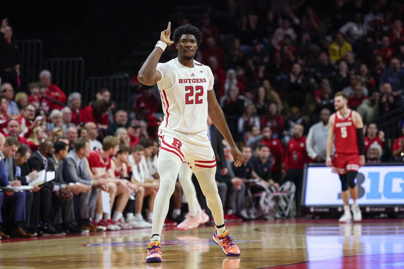 Feb 10, 2024; Piscataway, New Jersey, USA; Rutgers Scarlet Knights center Emmanuel Ogbole (22) reacts after a basket against the Wisconsin Badgers during the first half at Jersey Mike's Arena. Mandatory Credit: Vincent Carchietta-USA TODAY Sports