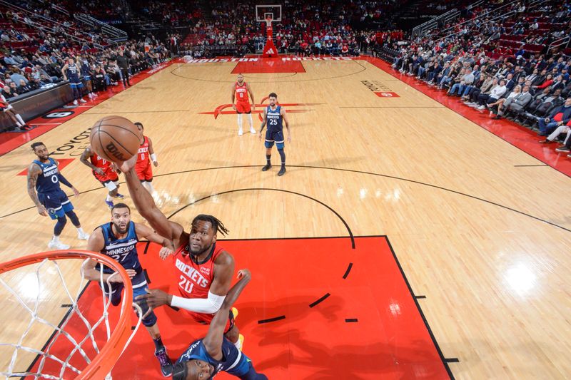 HOUSTON, TX - JANUARY 23:   Bruno Fernando #20 of the Houston Rockets drives to the basket during the game against the  Minnesota Timberwolves on January 23, 2023 at the Toyota Center in Houston, Texas. NOTE TO USER: User expressly acknowledges and agrees that, by downloading and or using this photograph, User is consenting to the terms and conditions of the Getty Images License Agreement. Mandatory Copyright Notice: Copyright 2023 NBAE (Photo by Logan Riely/NBAE via Getty Images)