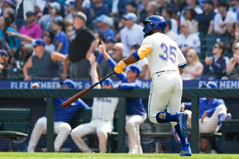 Aug 27, 2023; Seattle, Washington, USA; Seattle Mariners designated hitter Teoscar Hernandez (35) watches his solo-home run against the Kansas City Royals during the second inning at T-Mobile Park. Mandatory Credit: Joe Nicholson-USA TODAY Sports