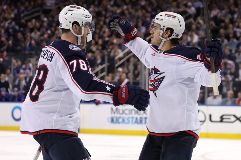 Feb 28, 2024; New York, New York, USA; Columbus Blue Jackets center Cole Sillinger (4) celebrates his goal against the New York Rangers with defenseman Damon Severson (78) during the third period at Madison Square Garden. Mandatory Credit: Brad Penner-USA TODAY Sports