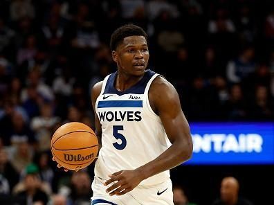 MINNEAPOLIS, MINNESOTA - NOVEMBER 01: Anthony Edwards #5 of the Minnesota Timberwolves dribbles the ball against the Denver Nuggets in the first quarter at Target Center on November 01, 2023 in Minneapolis, Minnesota. The Timberwolves defeated the Nuggets 110-89. NOTE TO USER: User expressly acknowledges and agrees that, by downloading and or using this photograph, User is consenting to the terms and conditions of the Getty Images License Agreement. (Photo by David Berding/Getty Images)