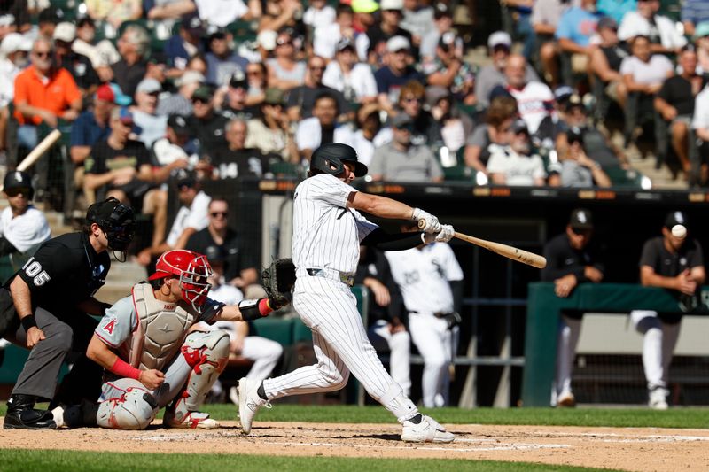 Sep 26, 2024; Chicago, Illinois, USA; Chicago White Sox outfielder Dominic Fletcher (7) hits a single against the Los Angeles Angels during the fifth inning at Guaranteed Rate Field. Mandatory Credit: Kamil Krzaczynski-Imagn Images