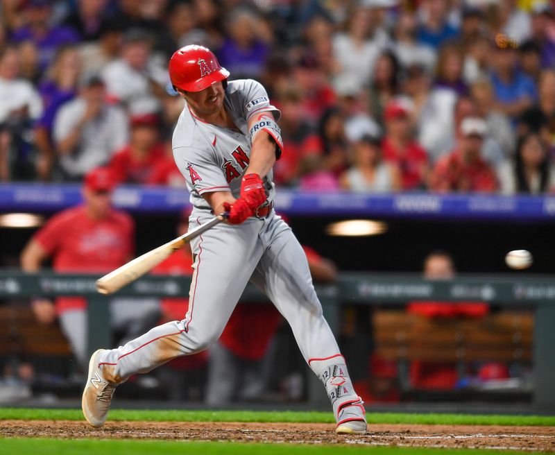 Jun 24, 2023; Denver, Colorado, USA; Los Angeles Angels first baseman Hunter Renfroe (12) hits a double in the fourth inning against the Colorado Rockies at Coors Field. Mandatory Credit: John Leyba-USA TODAY Sports