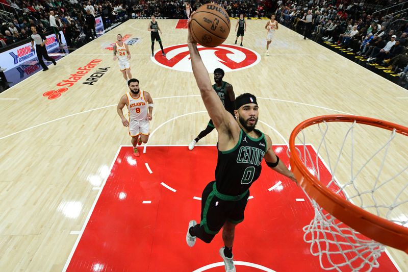 ATLANTA, GA - NOVEMBER 4: Jayson Tatum #0 of the Boston Celtics dunks the ball during the game against the Atlanta Hawks on November 4, 2024 at State Farm Arena in Atlanta, Georgia.  NOTE TO USER: User expressly acknowledges and agrees that, by downloading and/or using this Photograph, user is consenting to the terms and conditions of the Getty Images License Agreement. Mandatory Copyright Notice: Copyright 2024 NBAE (Photo by Adam Hagy/NBAE via Getty Images)
