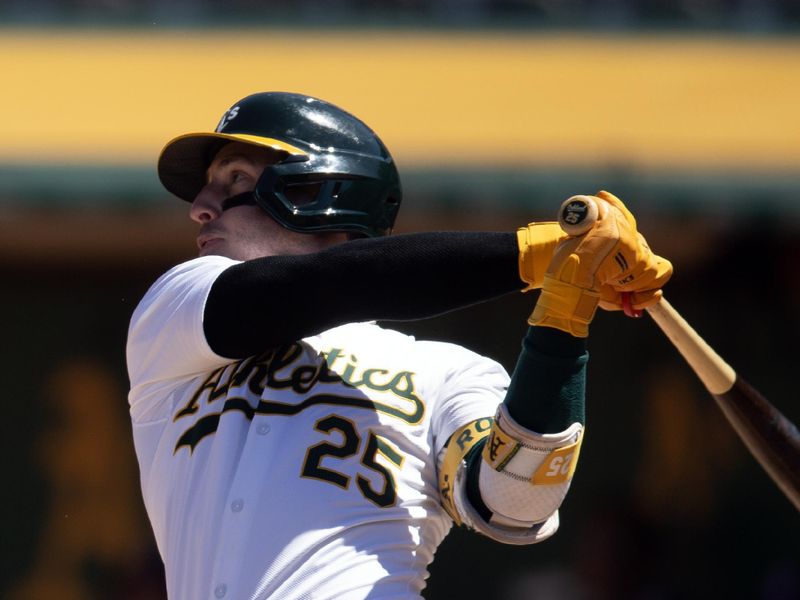 May 8, 2024; Oakland, California, USA; Oakland Athletics right fielder Brent Rooker (25) follows through on his three-run home run against the Texas Rangers during the seventh inning at Oakland-Alameda County Coliseum. Mandatory Credit: D. Ross Cameron-USA TODAY Sports