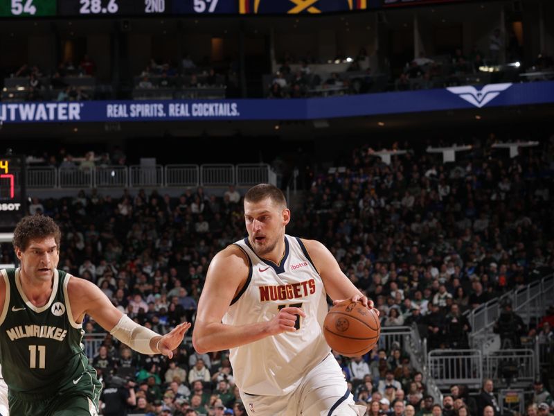 MILWAUKEE, WI - FEBRUARY 27: Nikola Jokic #15 of the Denver Nuggets drives to the basket during the game against the Milwaukee Bucks on February 27, 2025 at Fiserv Forum Center in Milwaukee, Wisconsin. NOTE TO USER: User expressly acknowledges and agrees that, by downloading and or using this Photograph, user is consenting to the terms and conditions of the Getty Images License Agreement. Mandatory Copyright Notice: Copyright 2025 NBAE (Photo by Gary Dineen/NBAE via Getty Images).