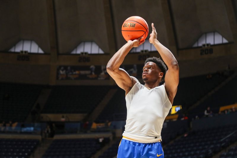 Jan 18, 2025; Morgantown, West Virginia, USA; West Virginia Mountaineers guard Joseph Yesufu (1) warms up prior to the game against the Iowa State Cyclones at WVU Coliseum. Mandatory Credit: Ben Queen-Imagn Images