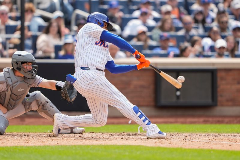 Jun 1, 2025; New York City, New York, USA; New York Mets right fielder Juan Soto (22) hits a home run against the Colorado Rockies during the eighth inning at Citi Field. Mandatory Credit: Gregory Fisher-Imagn Images