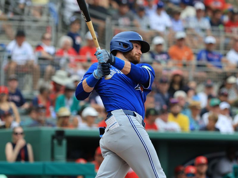Feb 22, 2026; Fort Myers, Florida, USA; Toronto Blue Jays outfielder RJ Schreck (9) singles during the third inning against the Boston Red Sox  at JetBlue Park at Fenway South. Mandatory Credit: Kim Klement Neitzel-Imagn Images