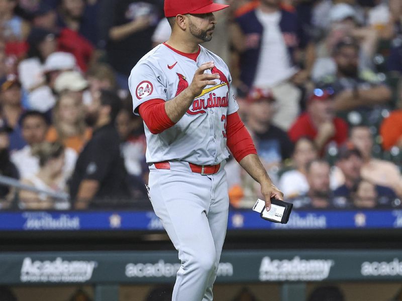 Jun 3, 2024; Houston, Texas, USA; St. Louis Cardinals manager Oliver Marmol (37) walks to the mound for a pitching change during the sixth inning against the Houston Astros at Minute Maid Park. Mandatory Credit: Troy Taormina-USA TODAY Sports