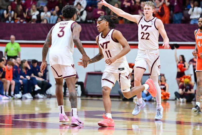 Mar 1, 2025; Blacksburg, Virginia, USA;  Virginia Tech Hokies guard Jaydon Young (3) congratulates Ben Hammond (11) after a three point basket against the Syracuse Orange at Cassell Coliseum. Mandatory Credit: Brian Bishop-Imagn Images