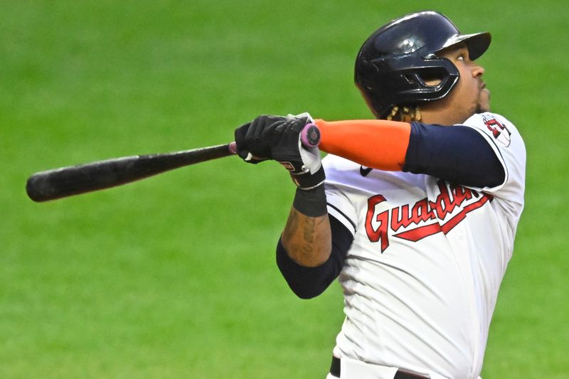 Sep 26, 2023; Cleveland, Ohio, USA; Cleveland Guardians third baseman Jose Ramirez (11) singles in the third inning against the Cincinnati Reds at Progressive Field. Mandatory Credit: David Richard-USA TODAY Sports