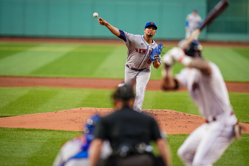 Jul 23, 2023; Boston, Massachusetts, USA; New York Mets starting pitcher Carlos Carrasco (59) throws a pitch against the Boston Red Sox in the first inning at Fenway Park. Mandatory Credit: David Butler II-USA TODAY Sports