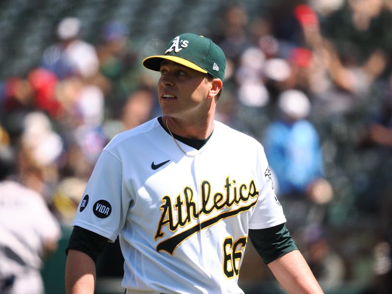 May 31, 2023; Oakland, California, USA; Oakland Athletics relief pitcher Sam Long (66) returns to the dugout after the top of the ninth inning against the Atlanta Braves at Oakland-Alameda County Coliseum. Mandatory Credit: Kelley L Cox-USA TODAY Sports