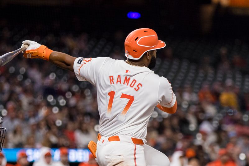 Sep 3, 2024; San Francisco, California, USA;  San Francisco Giants left fielder Heliot Ramos (17) hits an RBI single against the Arizona Diamondbacks during the ninth inning at Oracle Park. Mandatory Credit: John Hefti-Imagn Images